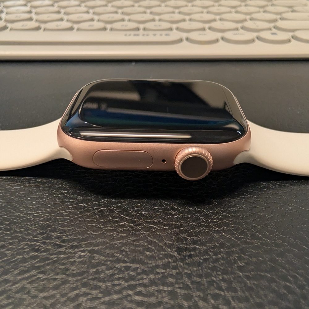 Apple Smartwatch with Rose Gold and White Band